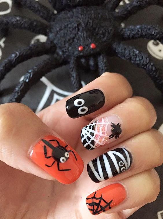 50 Cool and Creative Halloween Nails You’ll Try; Halloween Chevron Nails; Pumpkin Nails; Halloween Nail Art: Bats; Zombie nails,Skull nails, witch nails, spider nails.